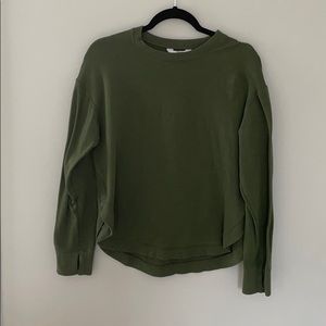 Green crew neck.